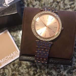 Rose gold watch with crystals